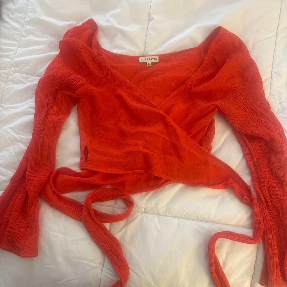 puffy sleeve blouse and ties on the side. Size medium but fits like a small